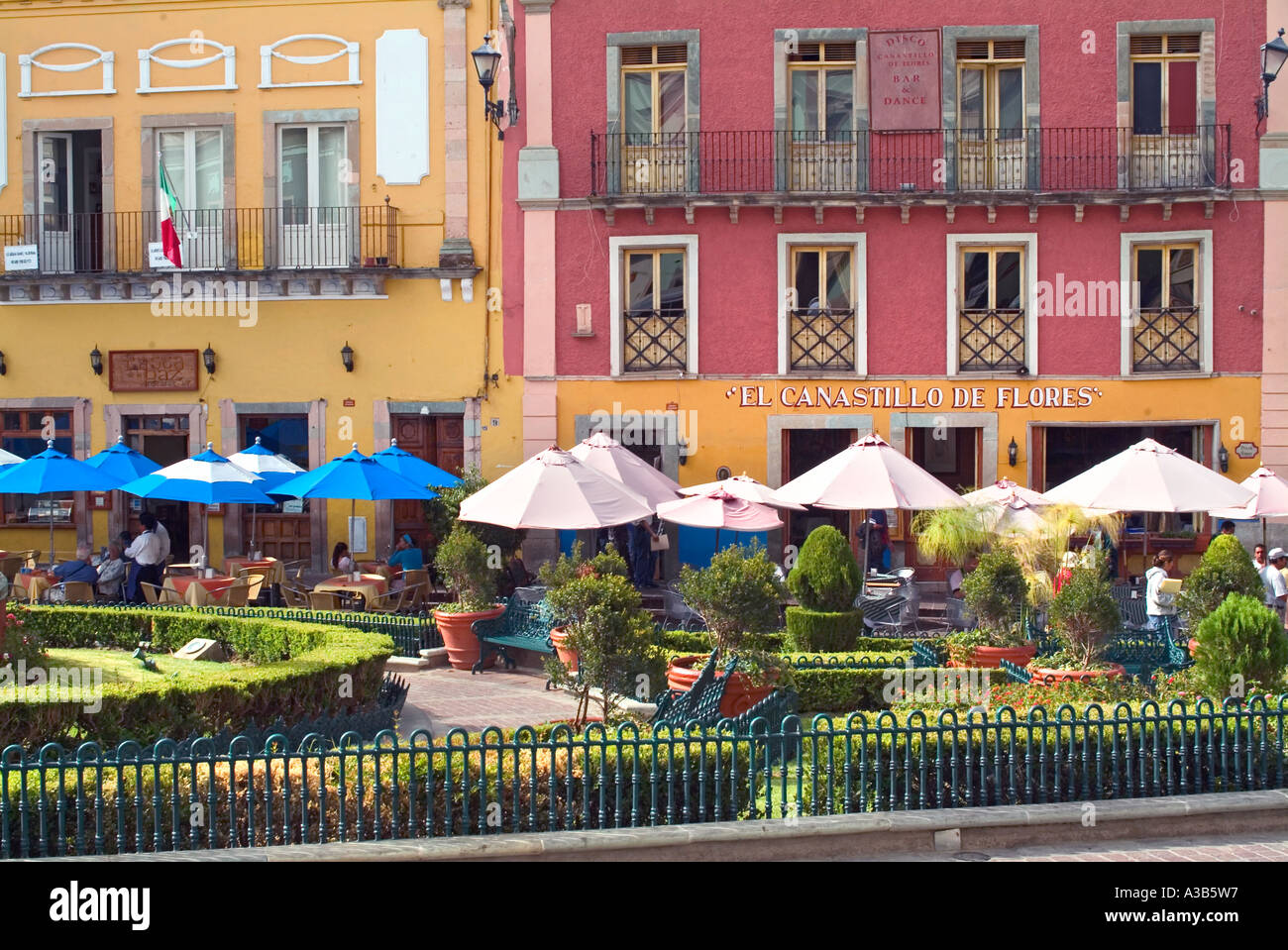 Outdoor sidewalk cafe with bright blue umbrellas in Guanajuato Mexico