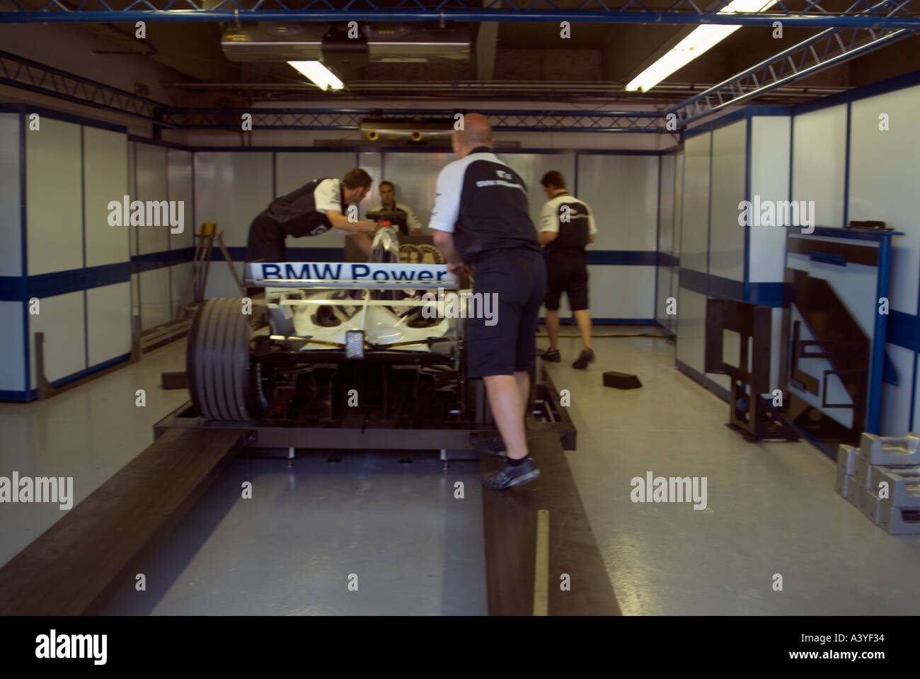 Formula 1 racing car pit lane garage weighing station BMW Gilles Stock