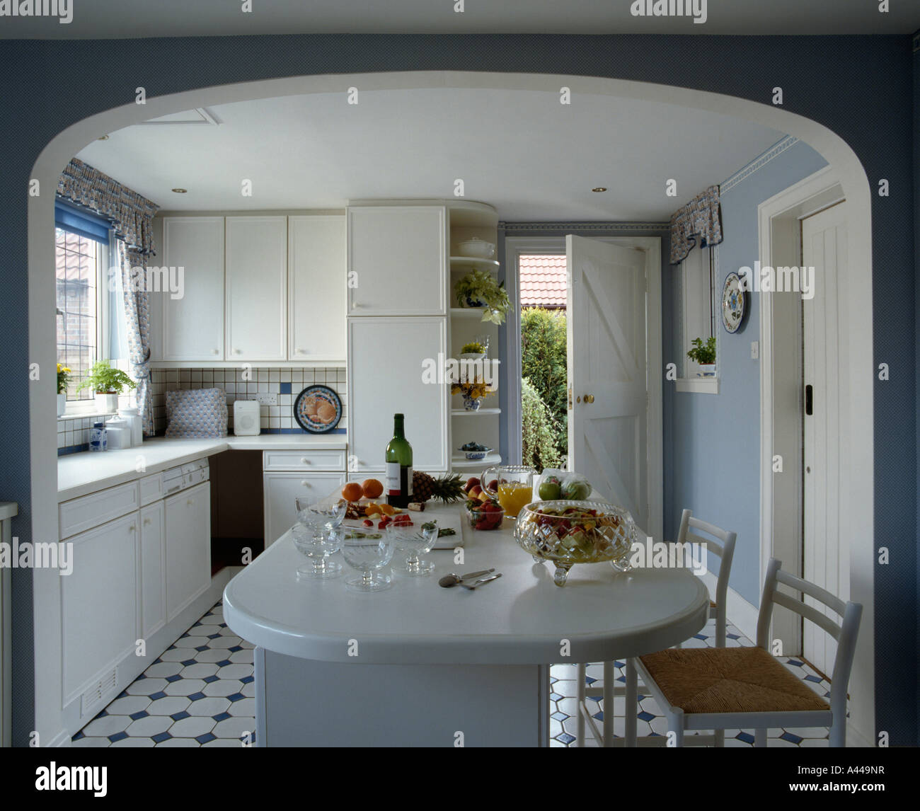 Kitchen extension with white units and breakfast bar and