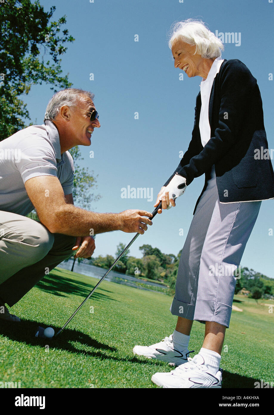 Mature Couple Playing Golf Stock Photo Alamy