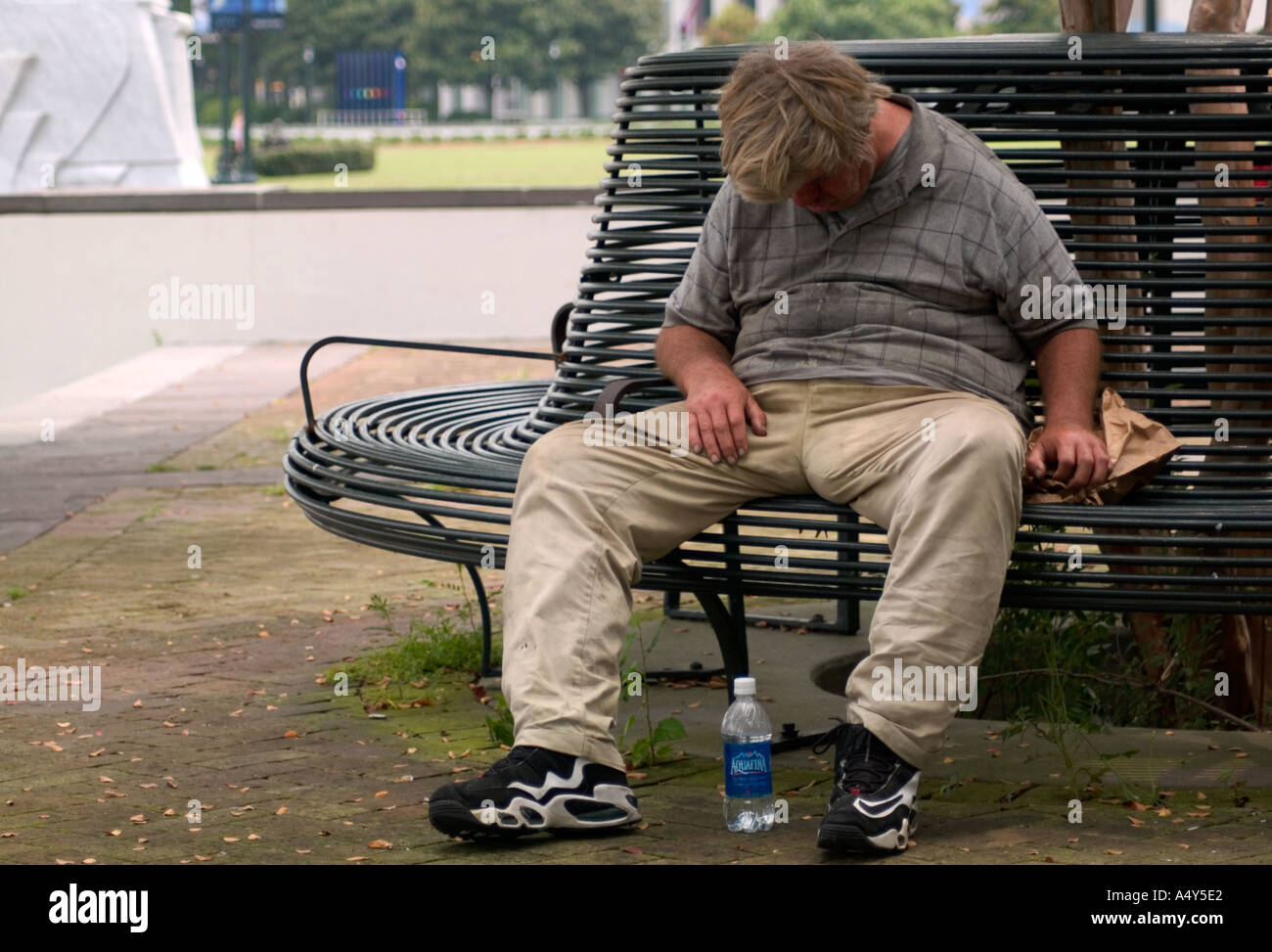Homeless Man Sleeping On Park Bench New Orleans LA USA Stock Photo Alamy