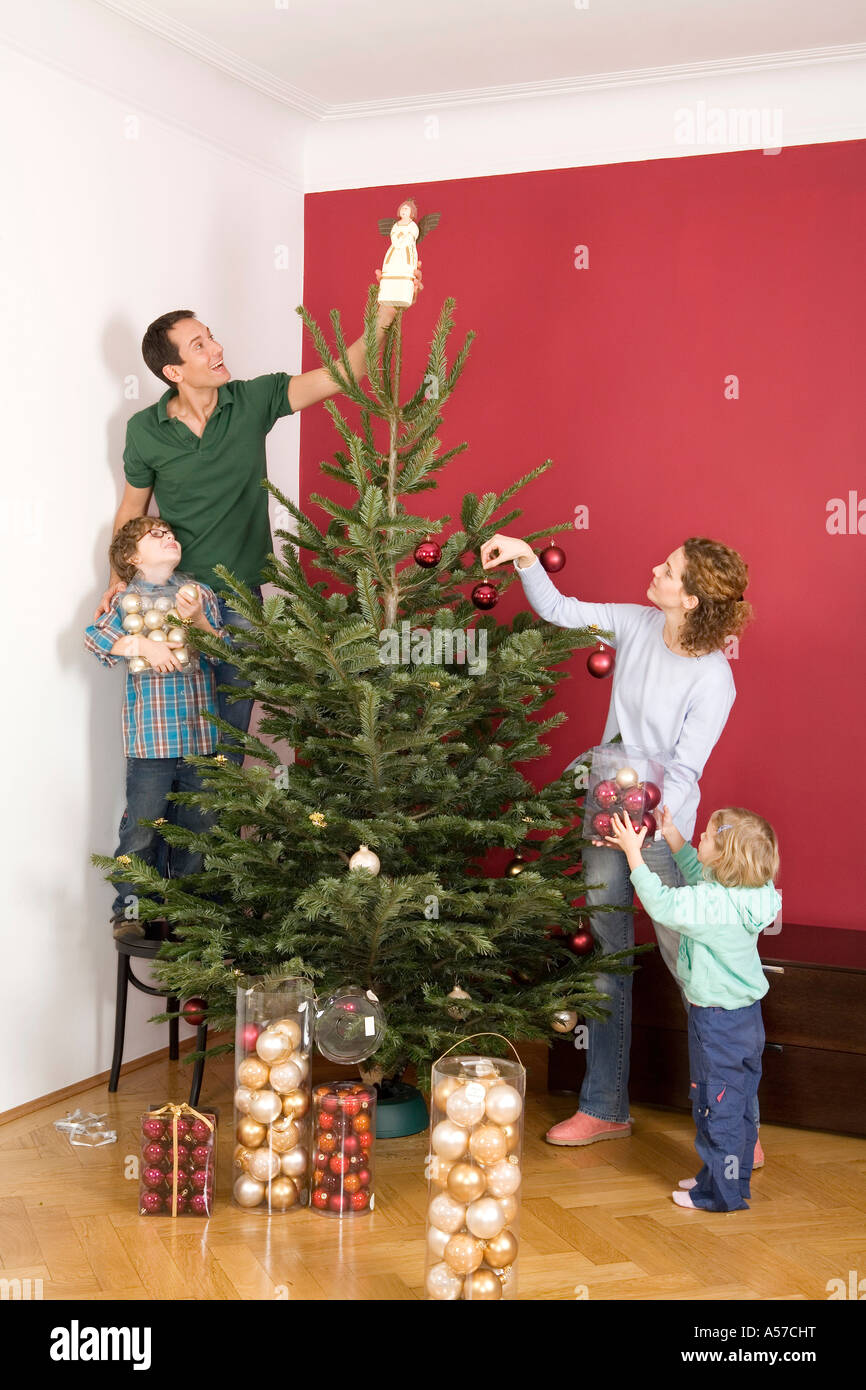 family decorating christmas tree stock photo royalty free family decorating christmas tree stock photo royalty free
