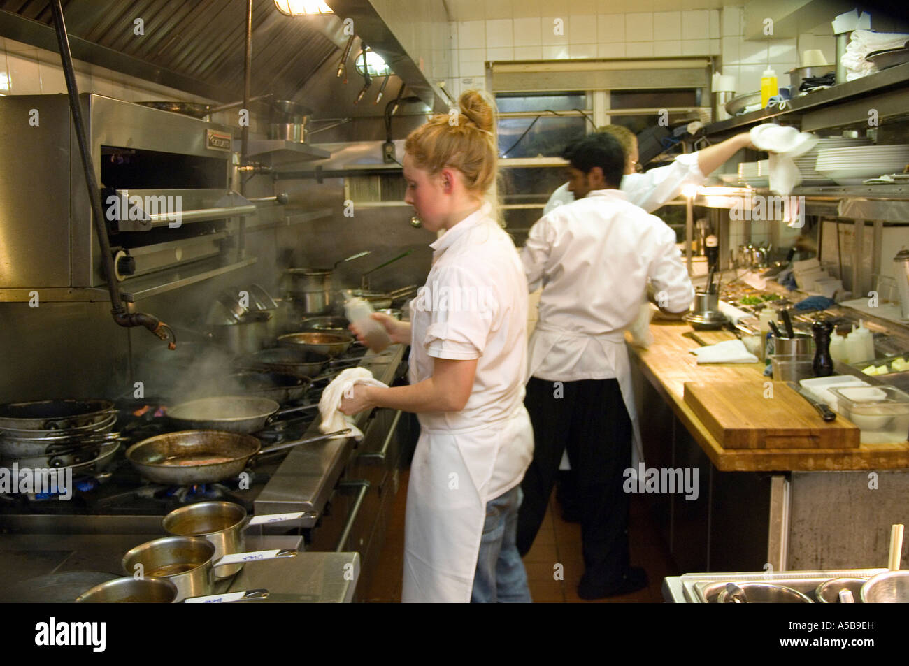 Busy Restaurant Kitchen team of restaurant kitchen staff busy at work stock photo, royalty Busy Restaurant Kitchen team of restaurant kitchen staff busy at work stock photo, royalty
