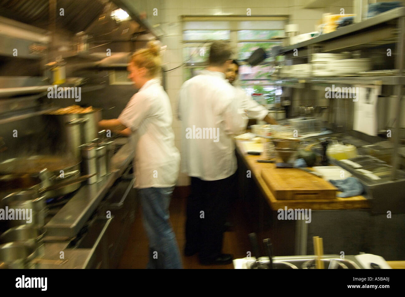 Busy Restaurant Kitchen team of restaurant kitchen staff busy at work stock photo, royalty Busy Restaurant Kitchen team of restaurant kitchen staff busy at work stock photo, royalty