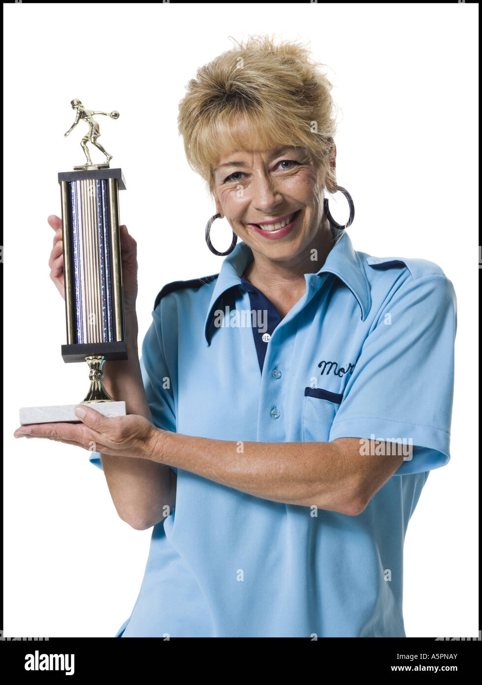 Female bowler holding trophy Stock Photo, Royalty Free Image 11365778