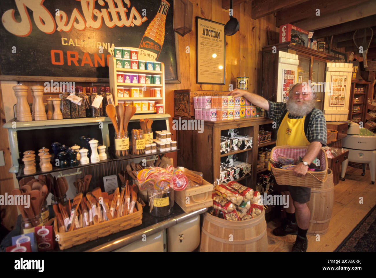 EMPLOYEE OF ZEB'S GENERAL STORE, NORTH CONWAY, NEW HAMPSHIRE, SELLING