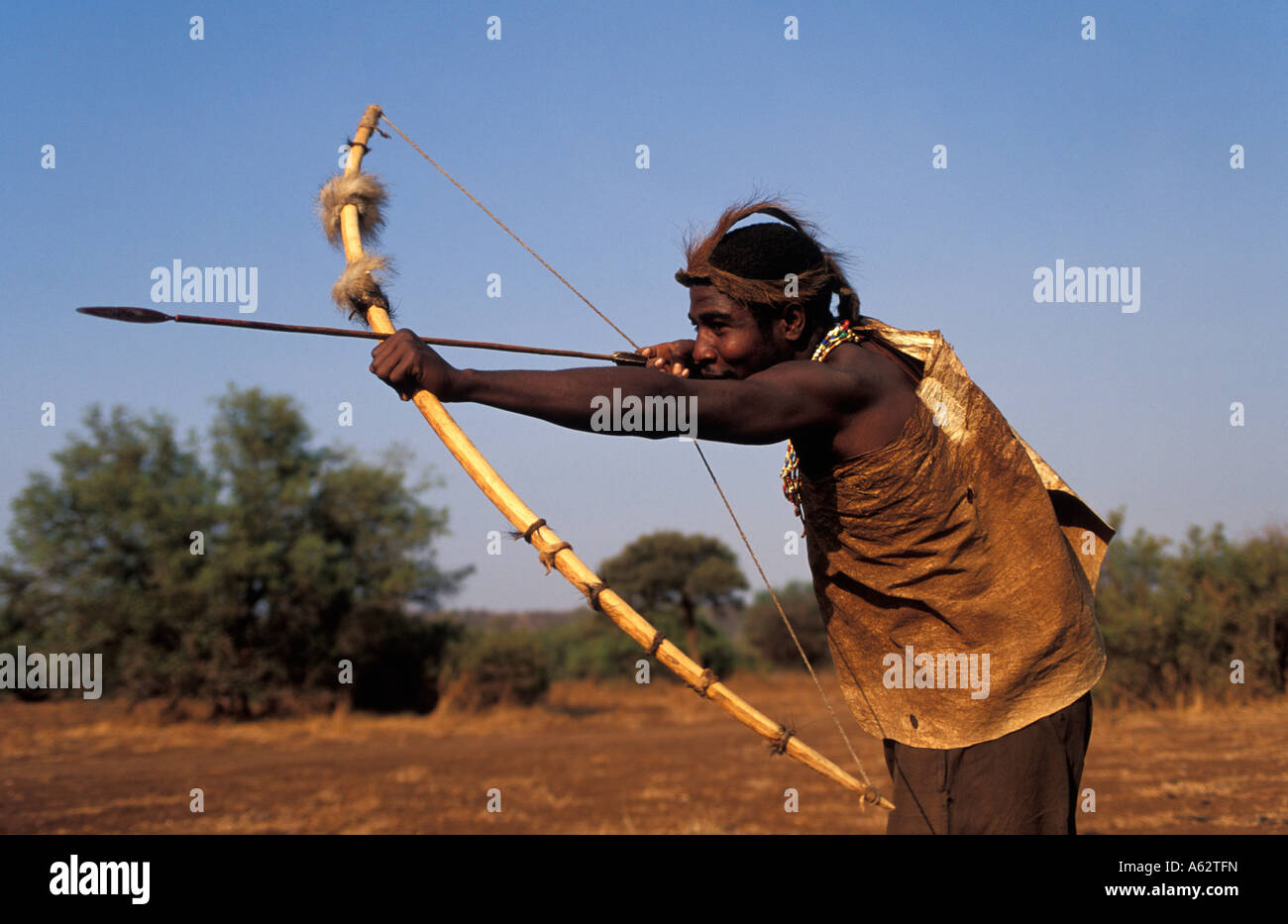 Hadza man hunting with bow and arrow Lake Eyasi Tanzania Small tribe