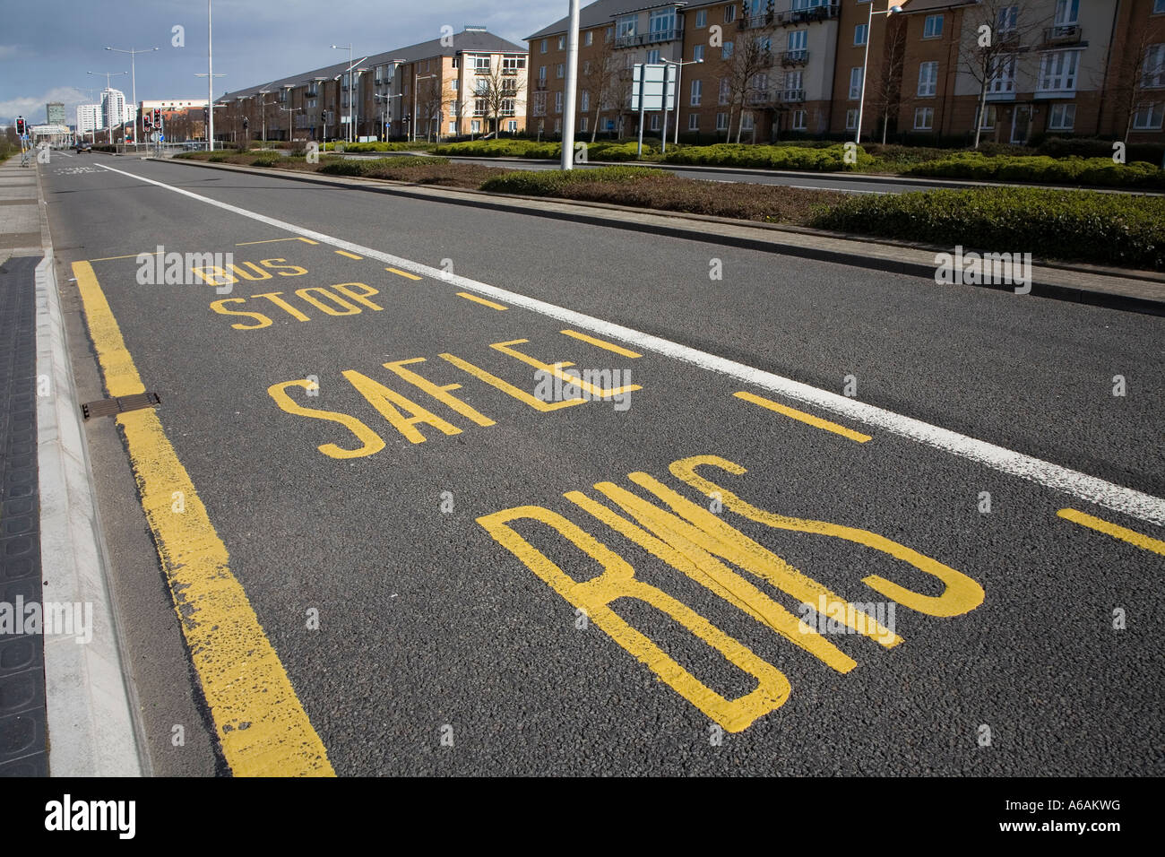 Bilingual Welsh English road markings at bus stop Cardiff Wales UK