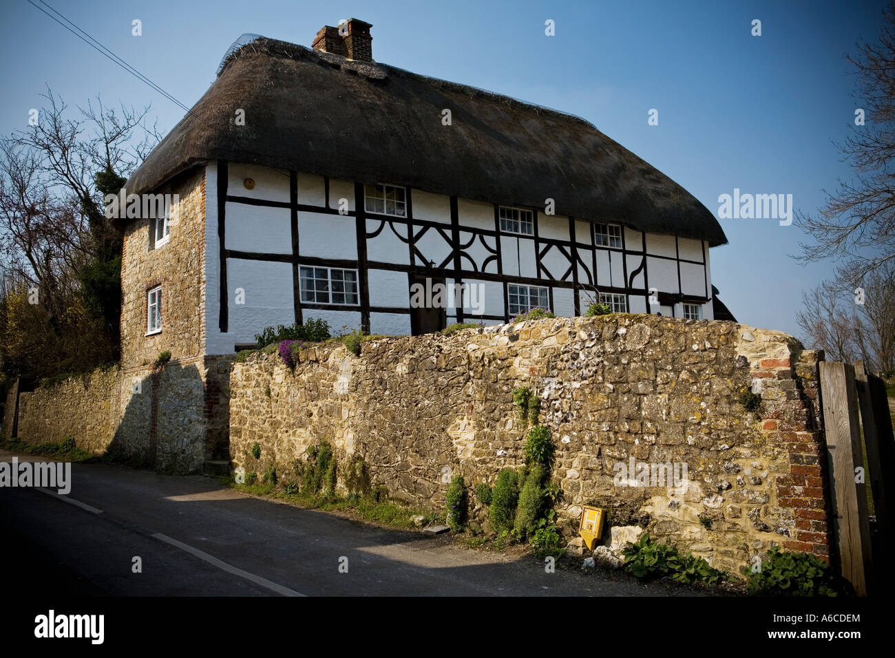Thatched roof stone cottage in Amberley village West Sussex Stock Photo