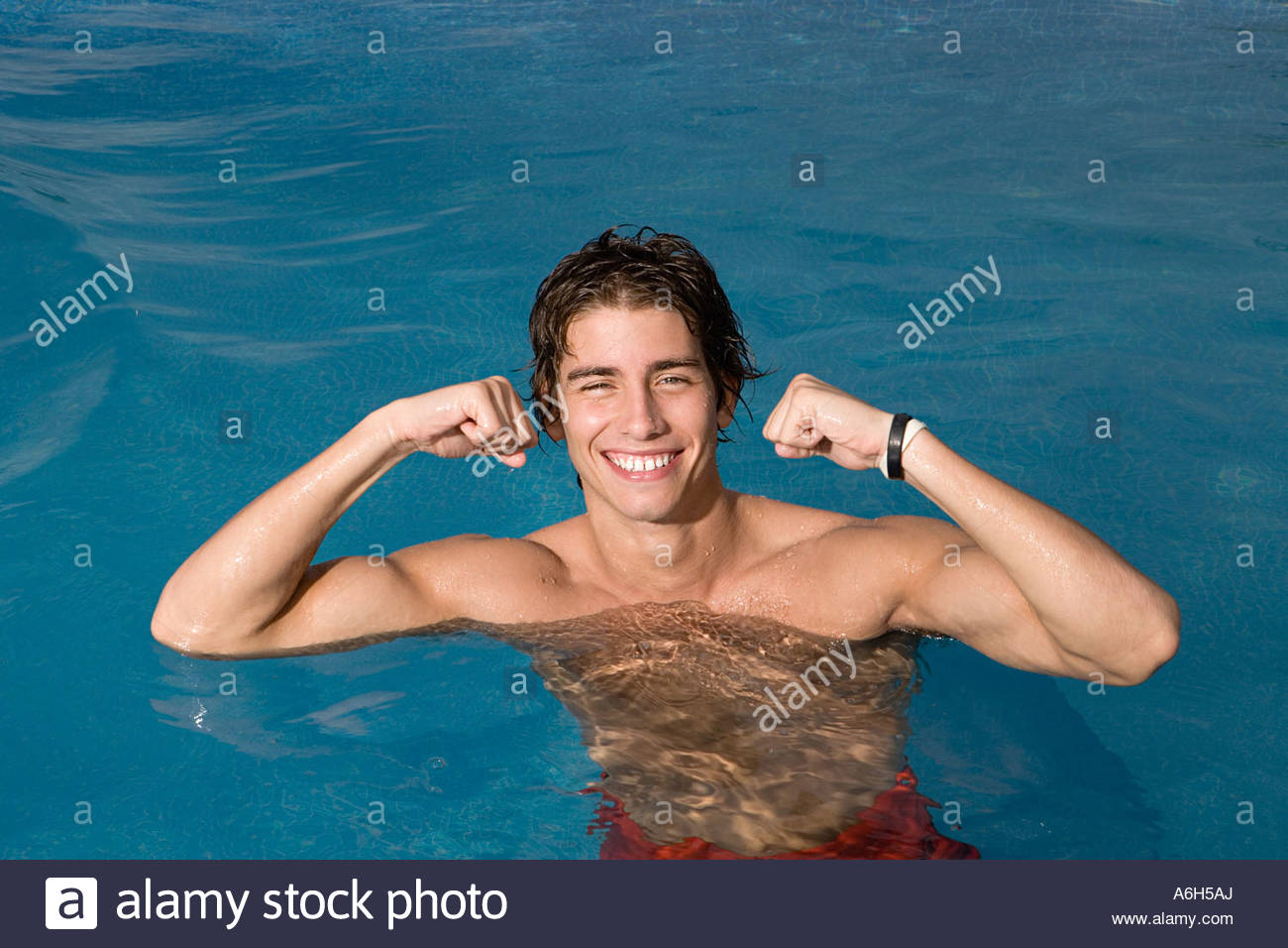 Teenage boy flexing muscles Stock Photo, Royalty Free Image: 11576777