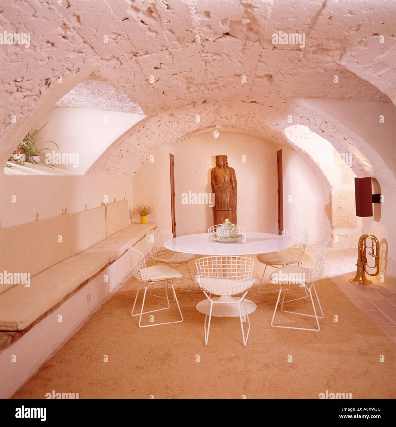 Banquette seating below window in basement diningroom with curved ...