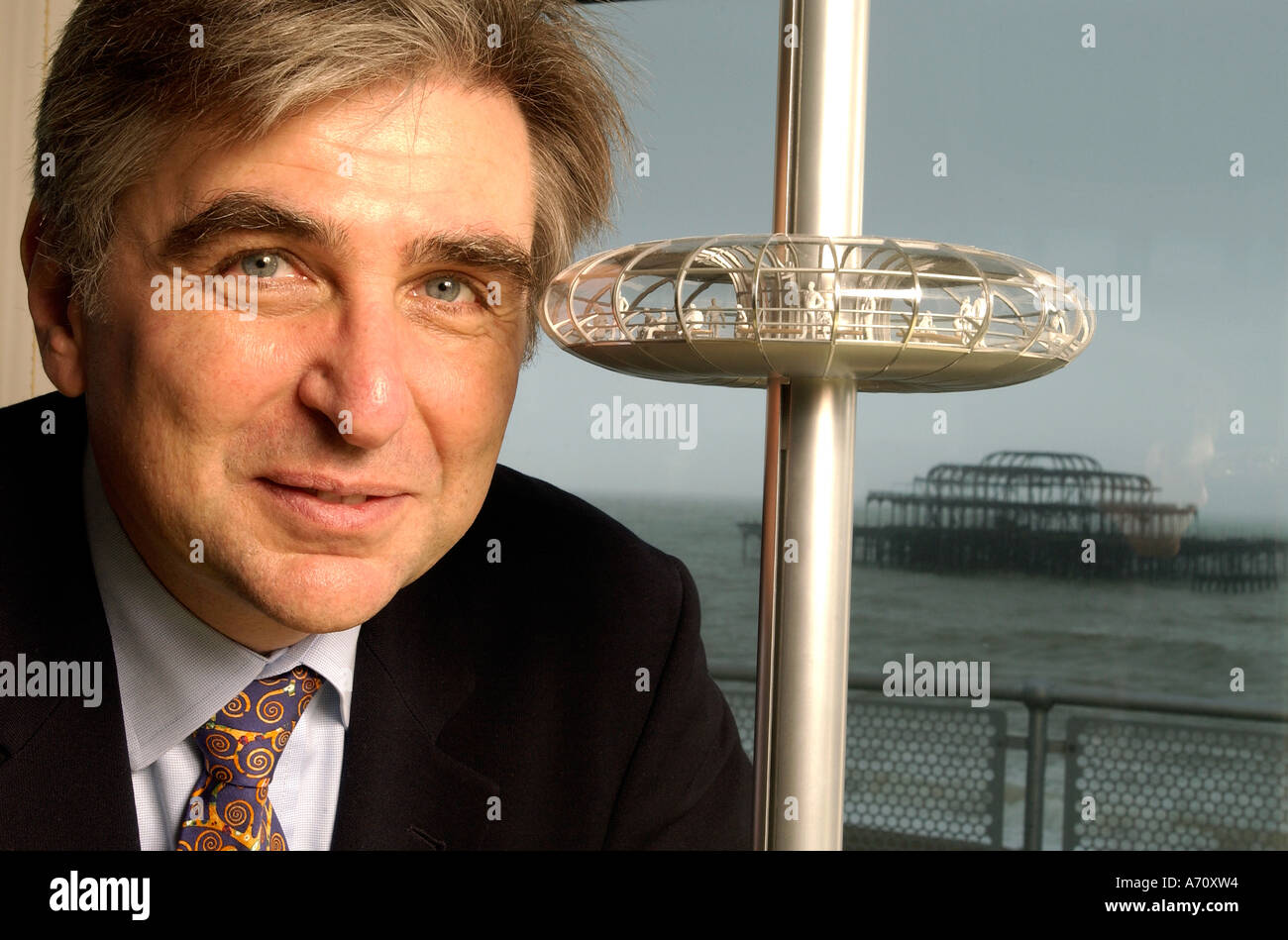Architect <b>David Marks</b> designer of the London Eye with a model of the pod of ... - architect-david-marks-designer-of-the-london-eye-with-a-model-of-the-A70XW4