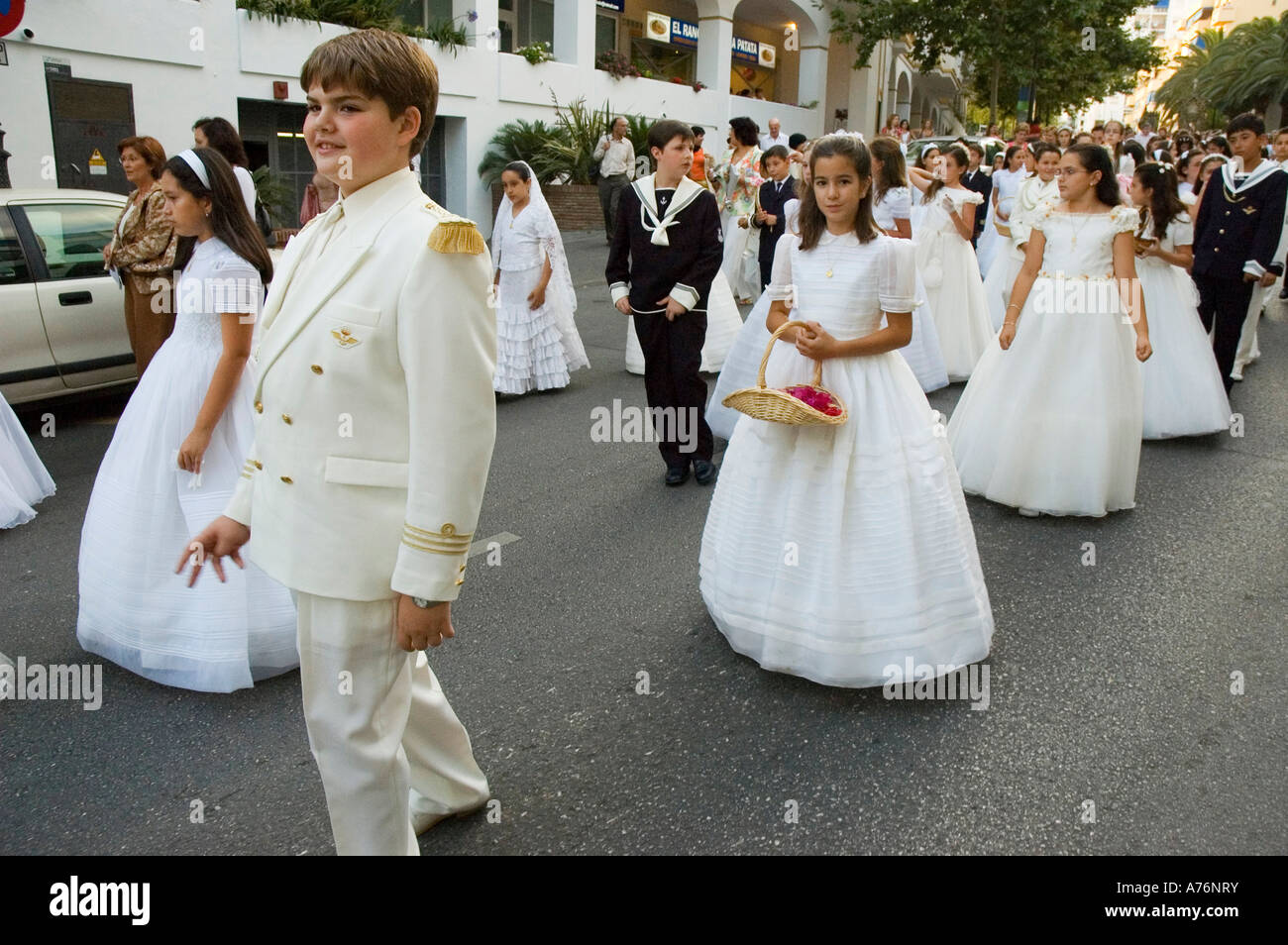 Girls and boys wearing their communion dresses in Corpus Christi Stock