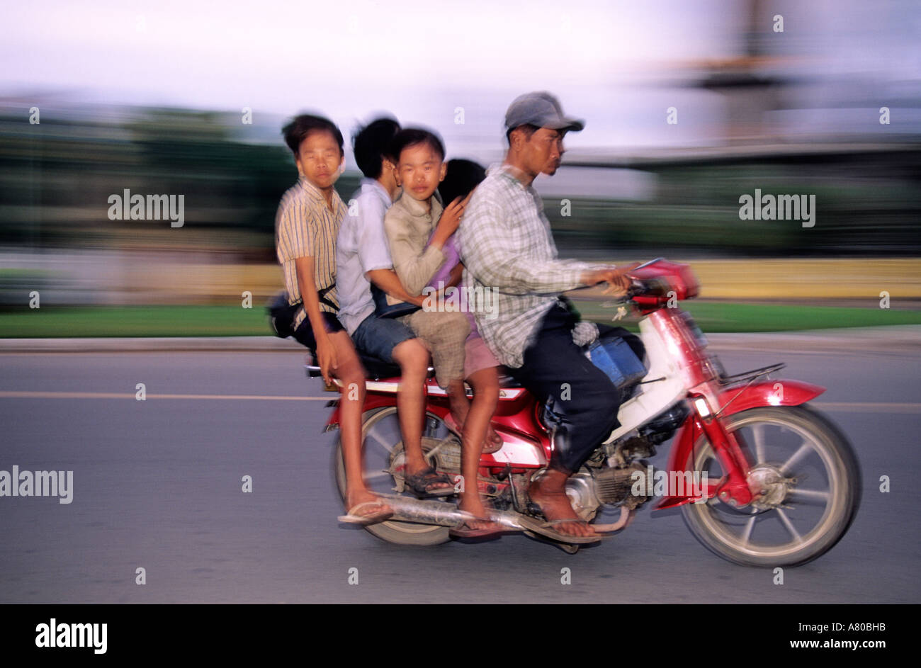 cambodia-phnom-penh-4-people-on-a-scoote