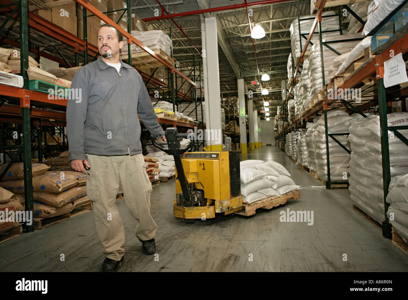 View of a worker moving goods on a pallet Stock Photo, Royalty Free