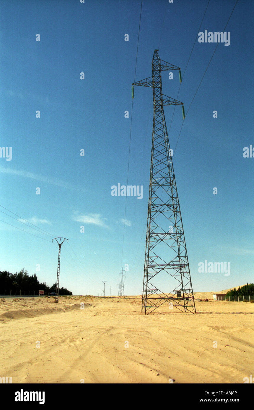 Electric Pylone Lines In The Desert Algeria Stock Photo Alamy