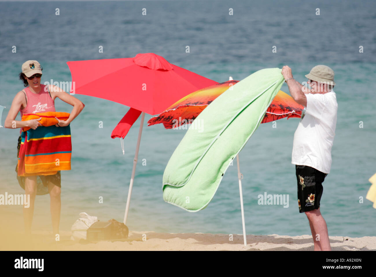 Couple Sunbathing On Beach Miami Hi Res Stock Photography And Images