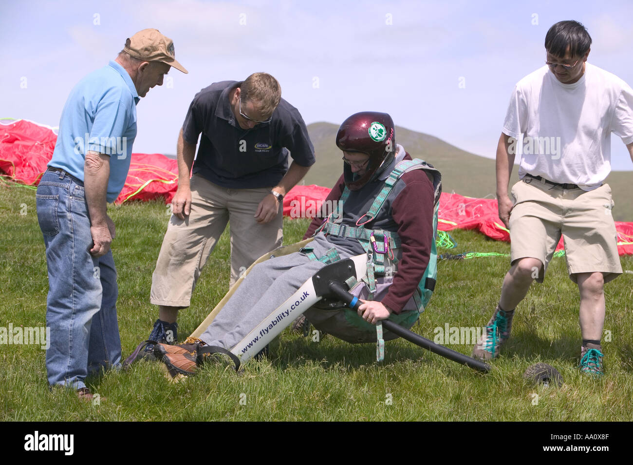 A Wheelchair Bound Disabled Person Preparing To Go Parapont Flying Stock Photo, Royalty Free