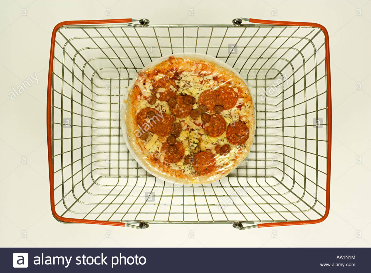 Pizza in a shopping basket Stock Photo, Royalty Free Image 12485215
