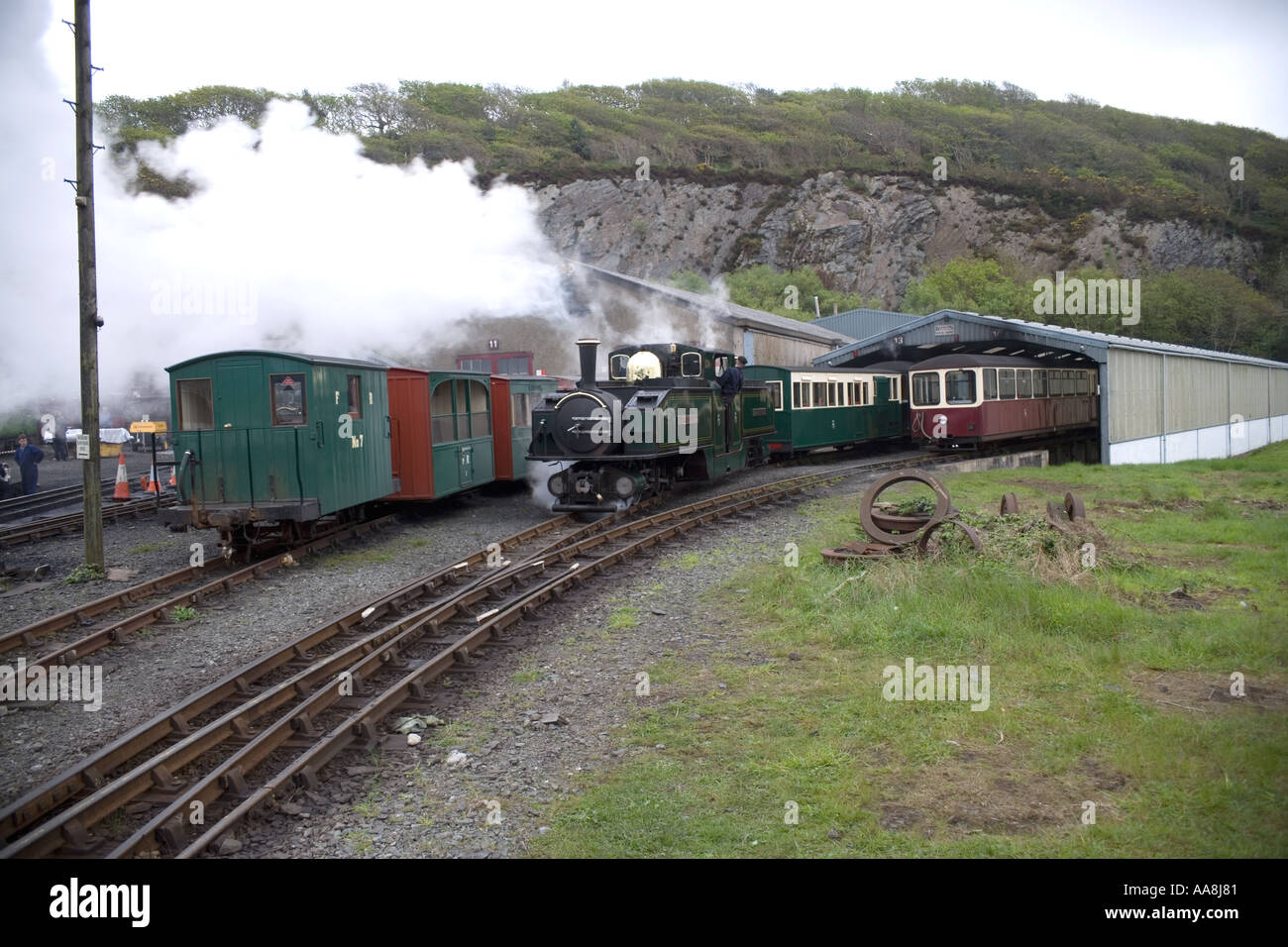narrow gauge steam train called the the earl of merioneth pulling pulling out works