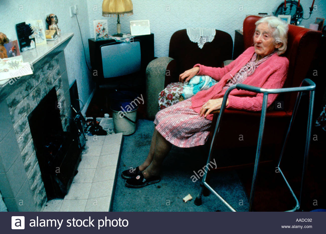 elderly-woman-looking-cold-sitting-in-fr