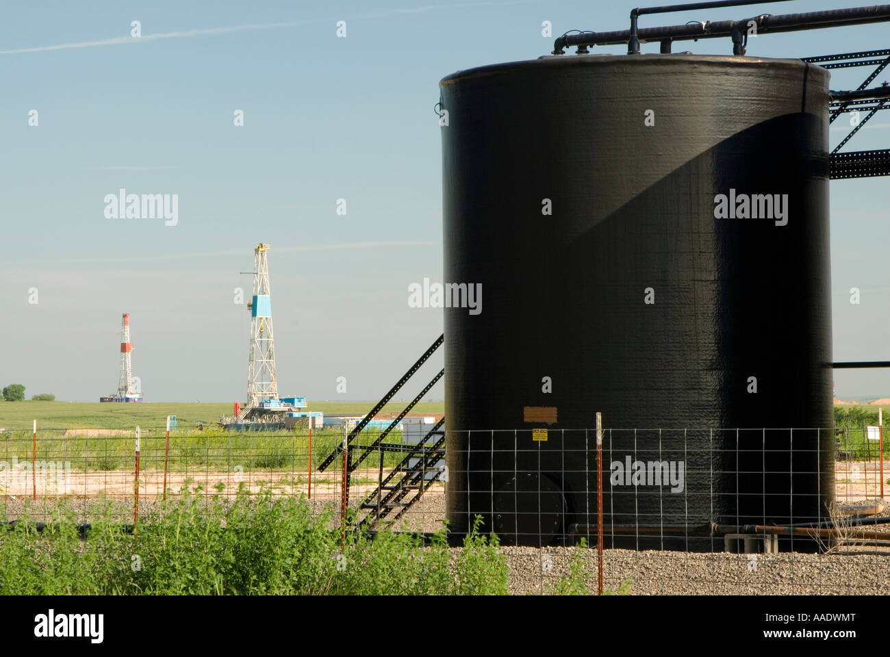 petroleum storage tanks on a drilling pad in the Texas Panhandle Stock