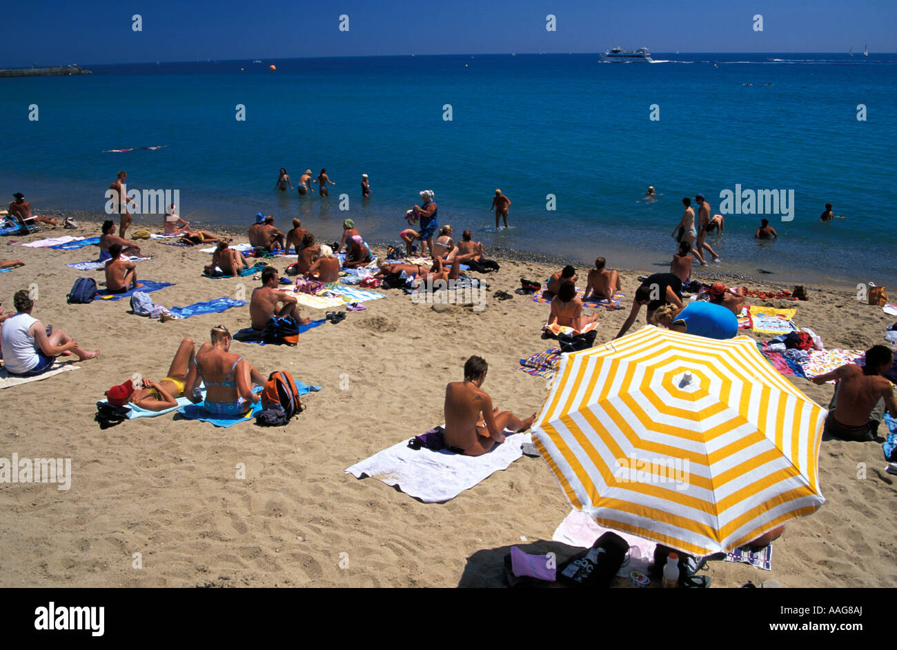 People Sunbathing At Beach Platja Barceloneta Barceloneta Barcelona