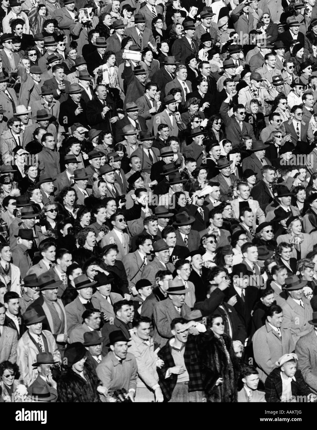 1940s CROWD IN BLEACHERS AT FOOTBALL GAME Stock Photo, Royalty Free