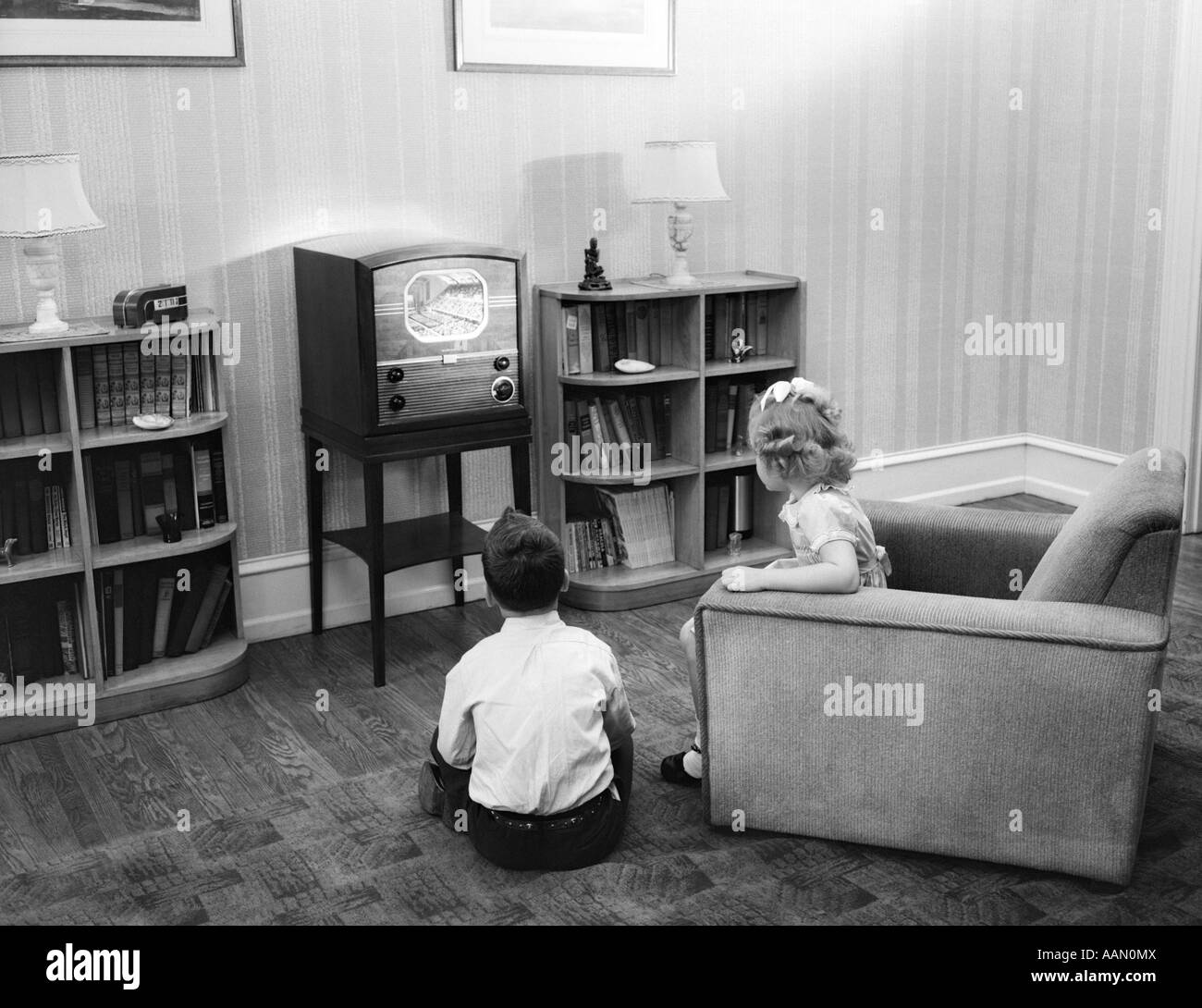 Living Room 1940s 1940s 1950s boy and girl with backs to viewer in living room Living Room 1940s 1940s 1950s boy and girl with backs to viewer in living room