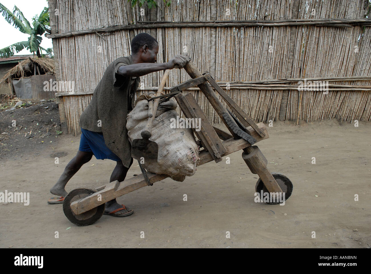 Man With Chukudu Homemade Wooden Scooter In North Kivu Province The Eastern Democratic Republic Of Congo Man With Chukudu Homemade Wooden Scooter In North Kivu Province The Eastern Democratic Republic Of Congo