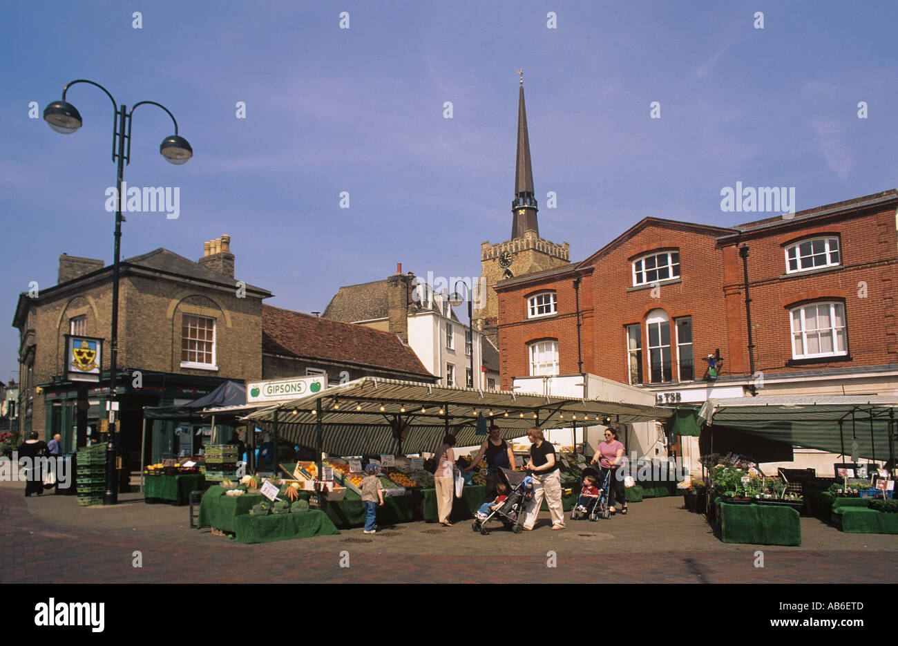 Farmers market in the centre of stowmarket overlooked by the spire of