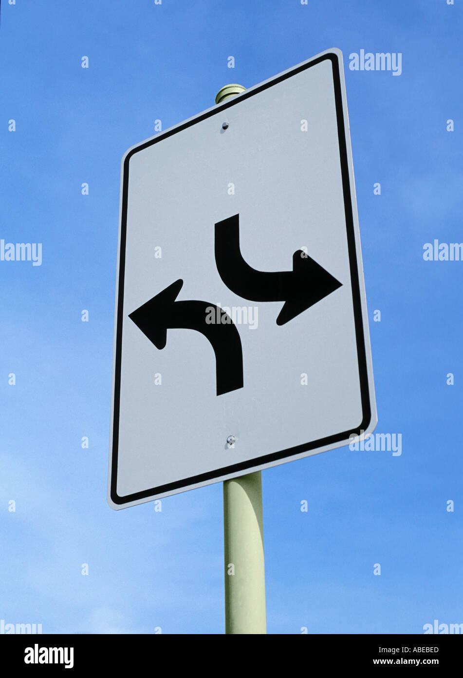 Road Sign With Two Curved Arrows Pointing In Opposite Directions Stock 