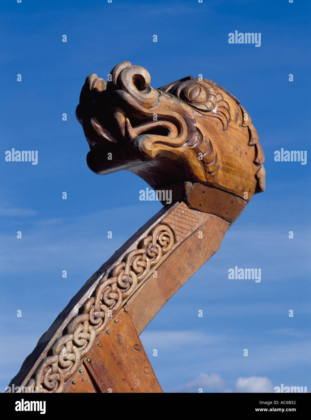 Carved wooden dragon figurehead on the prow of a replica 