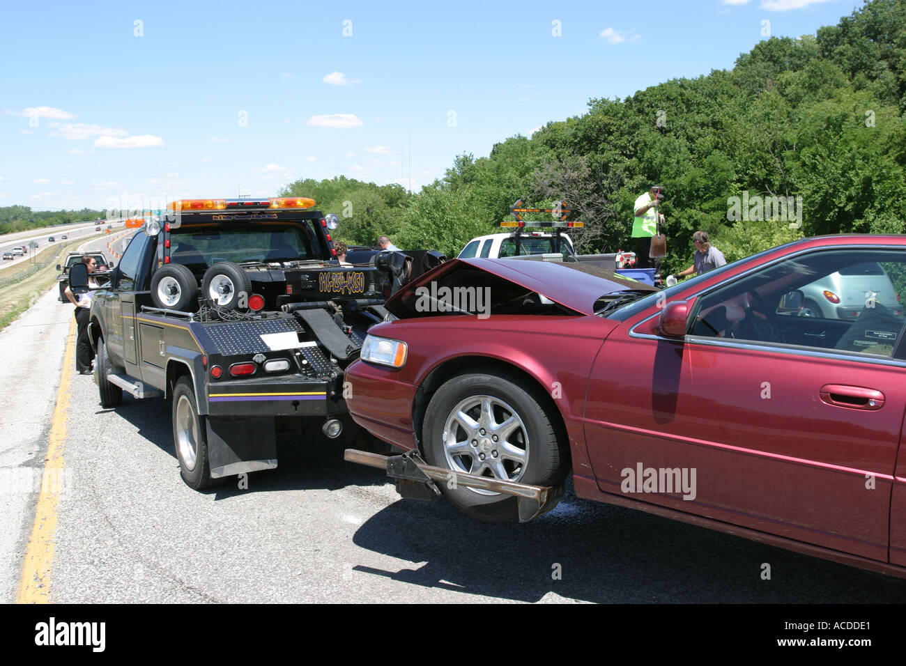 Accident Car being towed away from the scene of the