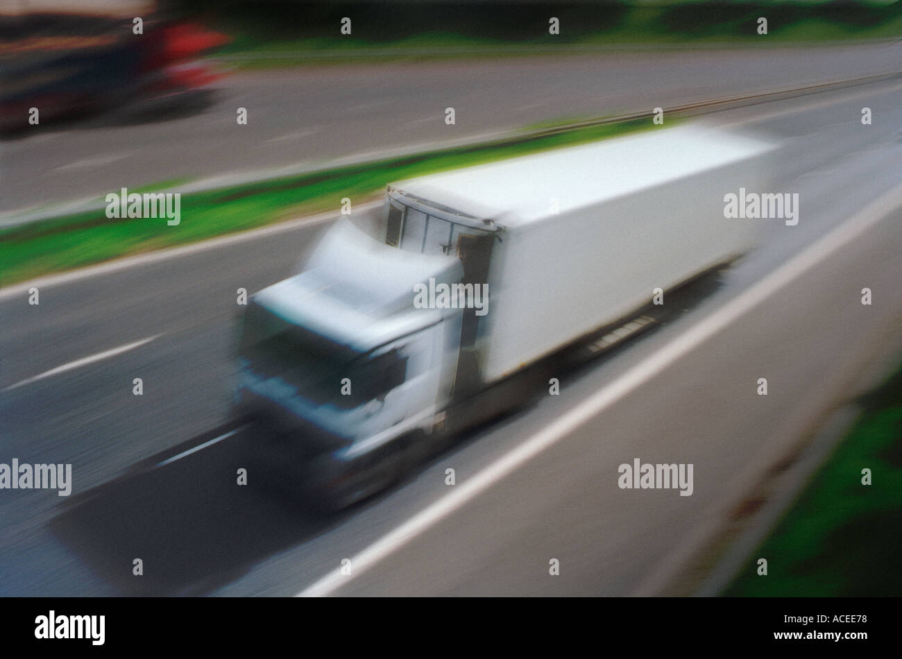 Fast moving lorries on a motorway Stock Photo, Royalty Free Image