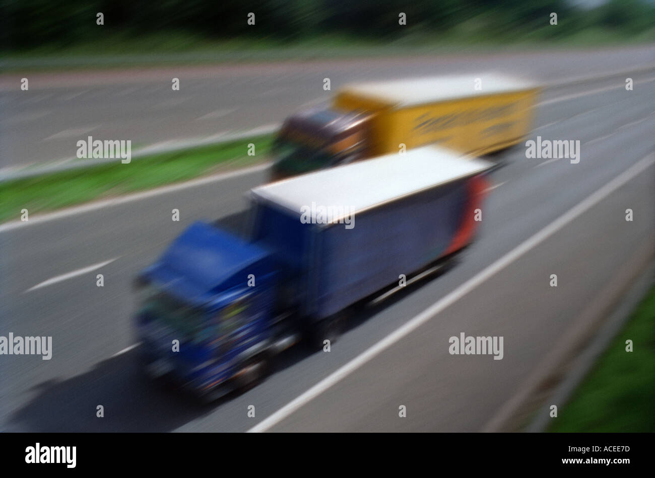 Fast moving lorries on a motorway Stock Photo, Royalty Free Image