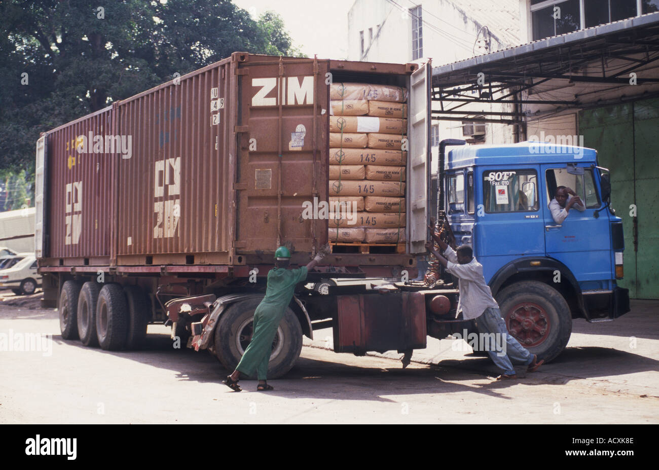 Men packing Container Truck with sacks of tea ready for export Stock Photo, Royalty Free Image 