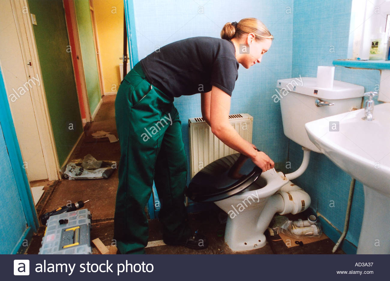 female-apprentice-plumber-on-the-job-training-blackburn-lancs-uk-AD3A37.jpg