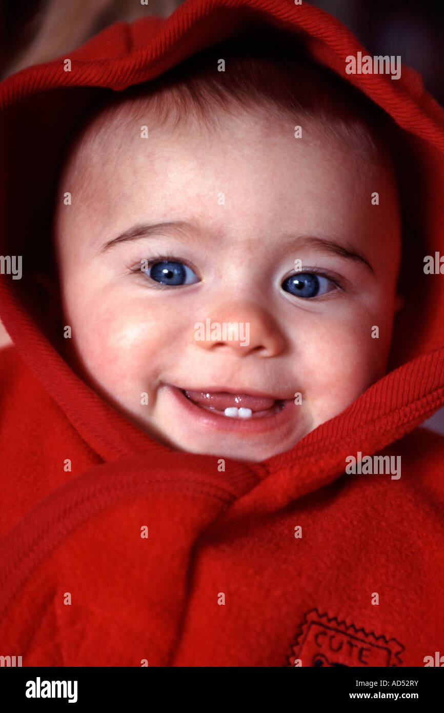 A 12-month old baby girl in a <b>red hoody</b>. Stock Photo - a-12-month-old-baby-girl-in-a-red-hoody-AD52RY