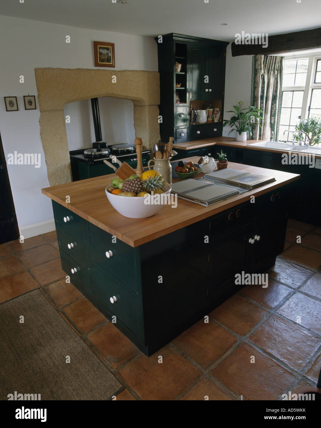Oven Hob In Island Unit Stock Photos Large Bowl Of Fruit And Hob On Island Unit With Drawers In Country Kitchen Terracotta