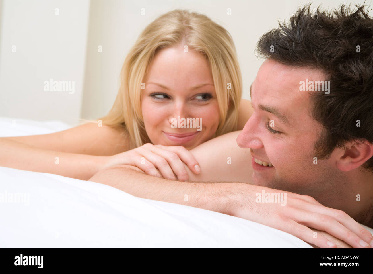 young-naked-couple-cuddling-and-happy-in
