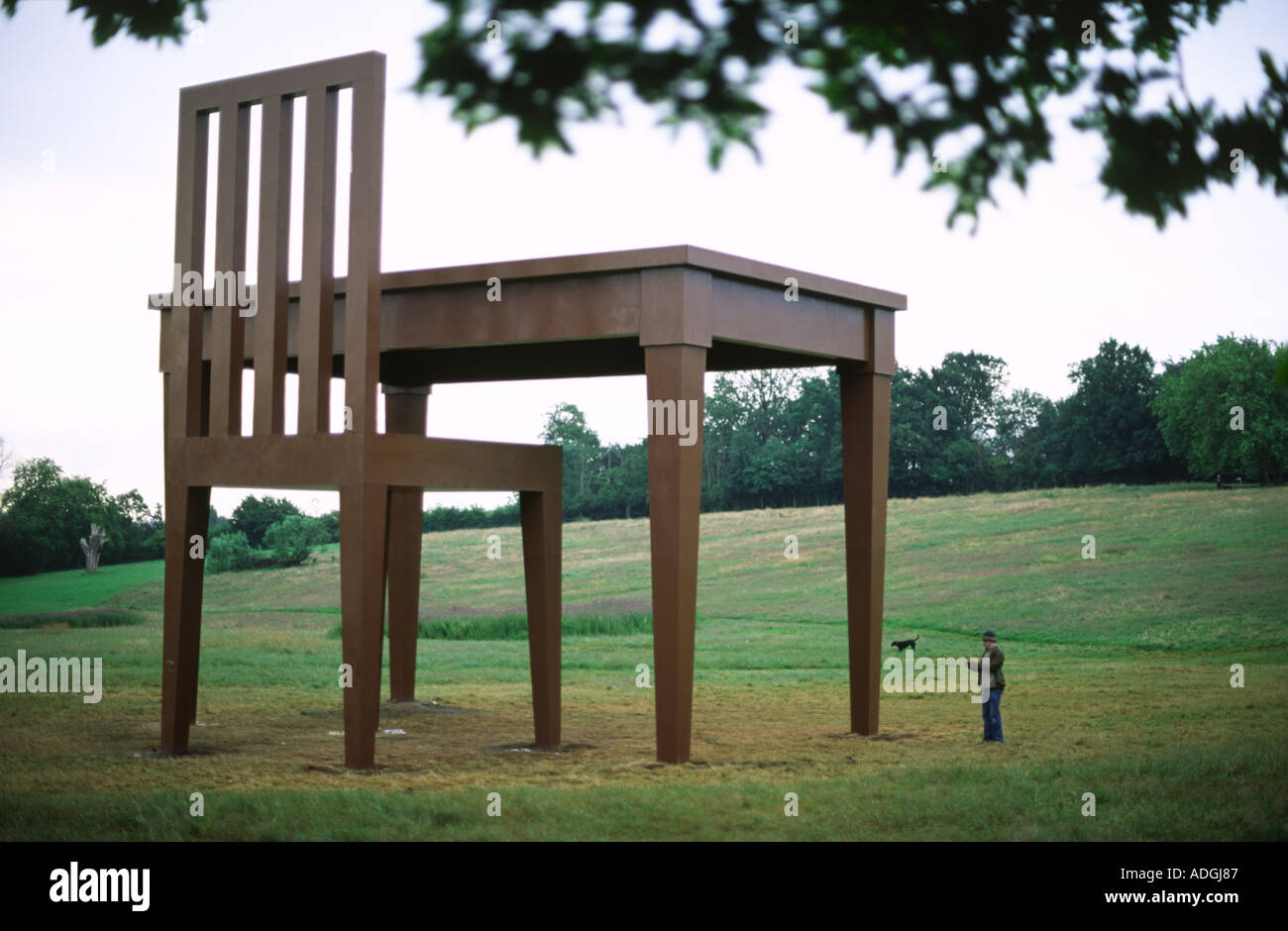person-stood-next-to-a-gigantic-table-and-chair-on-hampstead-heath-ADGJ87.jpg