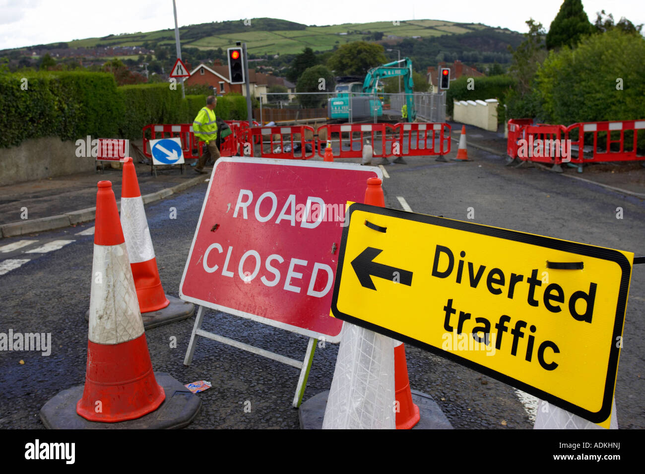 road closed sign and yellow diverted traffic sign on traffic cones