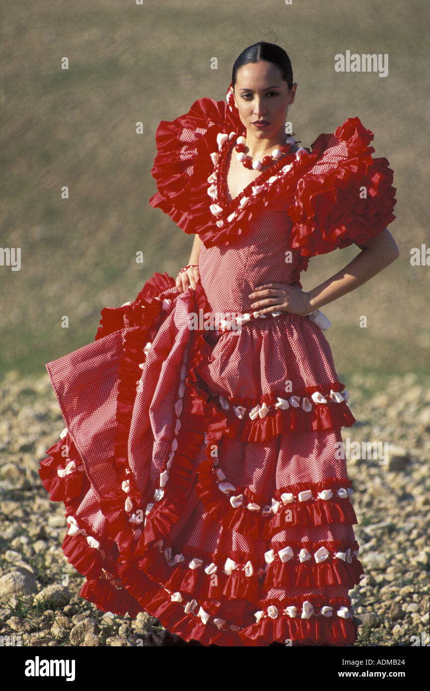 Spanish young woman dressed in sevillana traditional ...