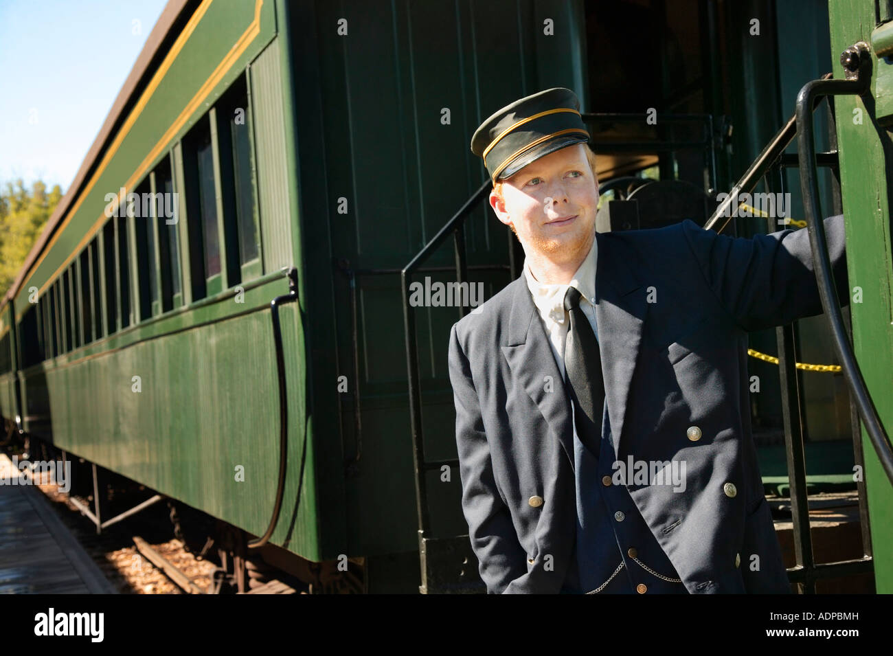Train conductor on an oldfashioned train Stock Photo, Royalty Free