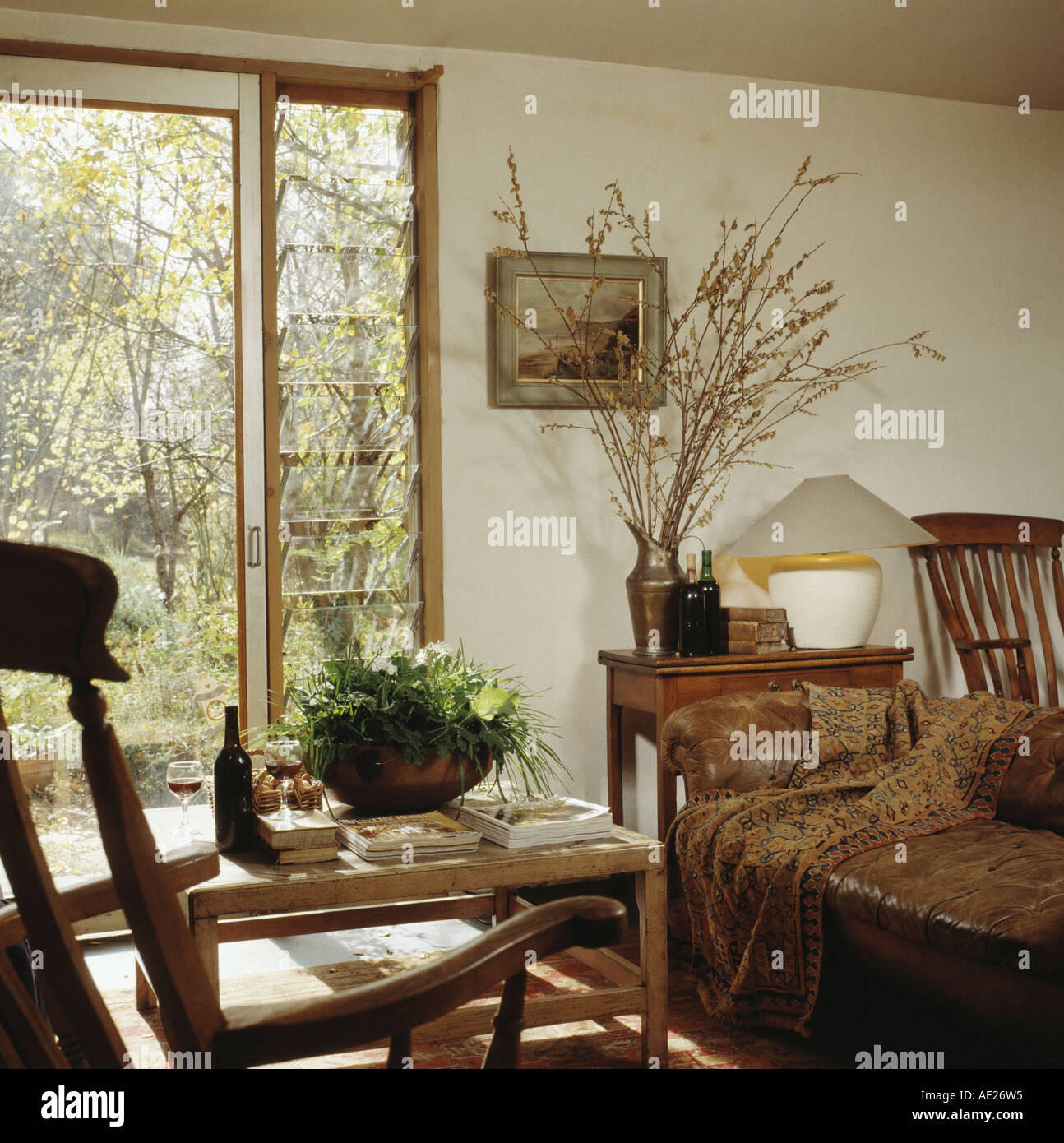 Simple Country Living Room houseplants in bowl on simple wooden table in front of sliding Simple Country Living Room houseplants in bowl on simple wooden table in front of sliding