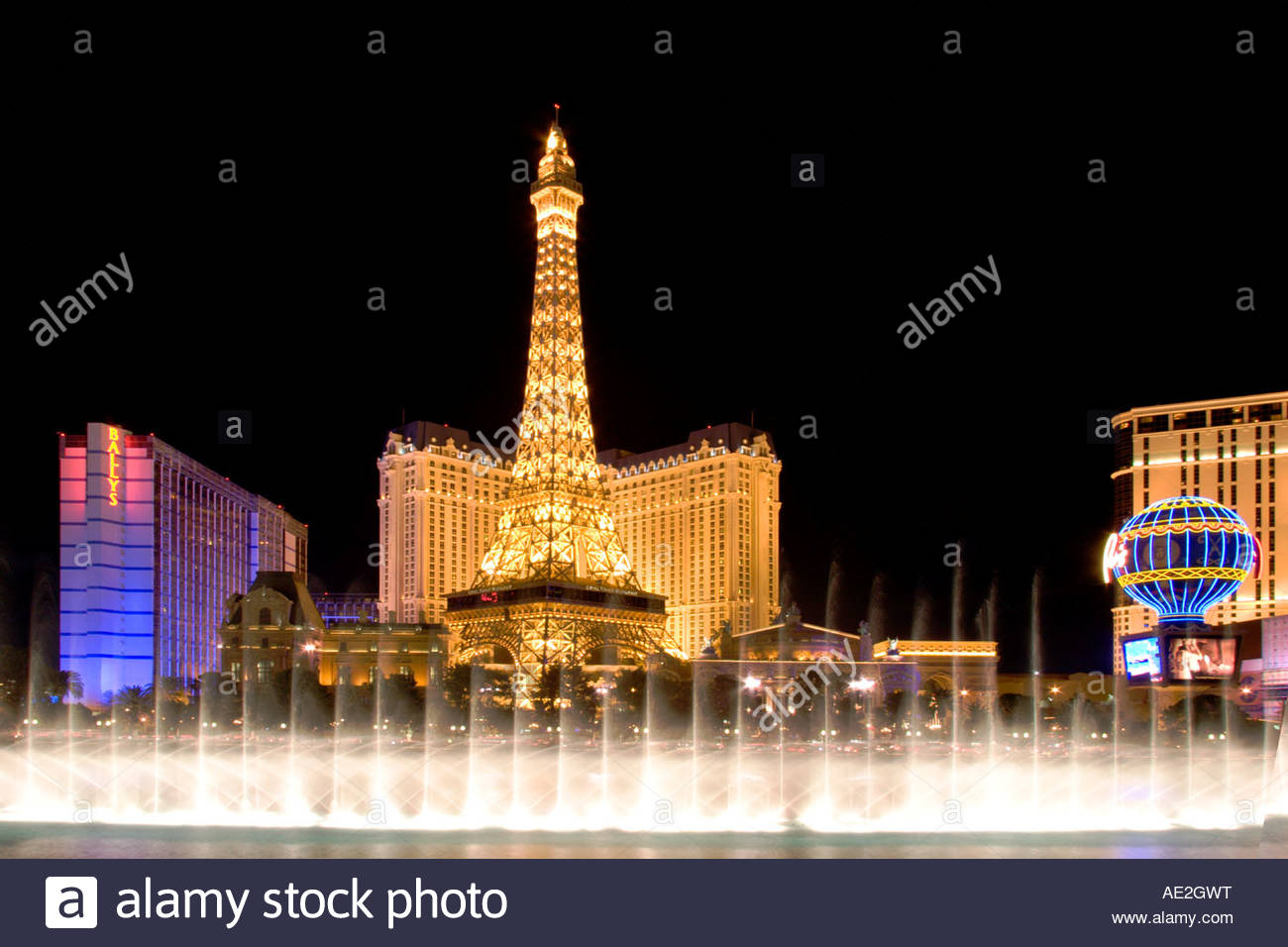 Bellagio Fountains at Night with the Paris Eiffel Tower in the Stock