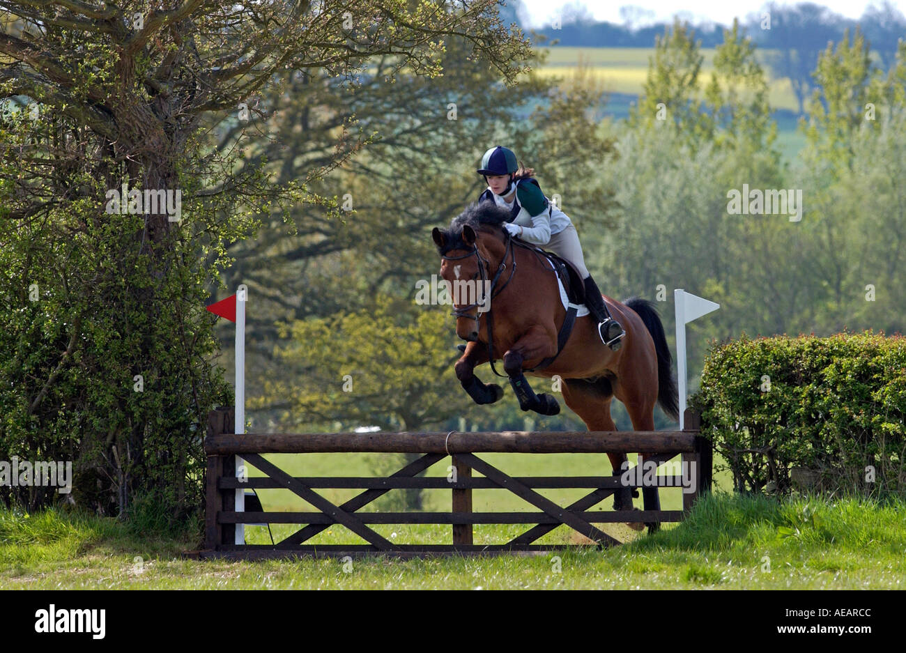 Young rider competing in cross country equine event in Oxfordshire
