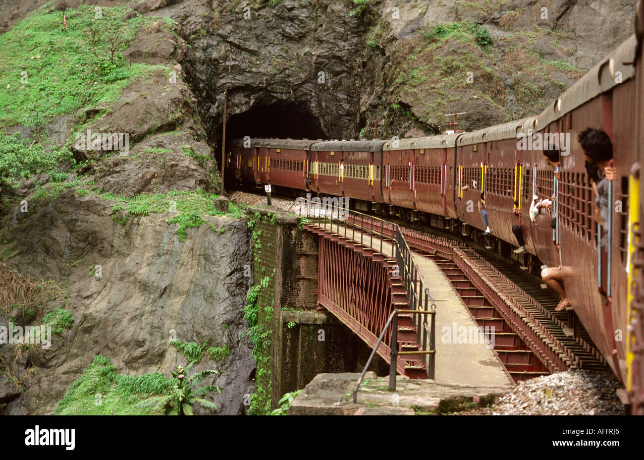 India Karnataka rail travel train entering tunnel Stock Photo, Royalty