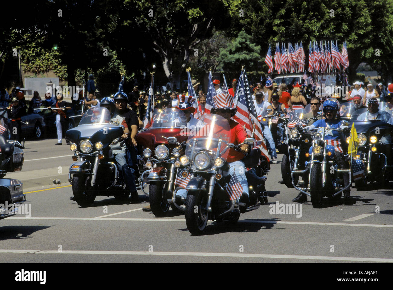 Harley Davidson riders get going in the 4th of July Parade in Stock Photo, Royalty Free Image